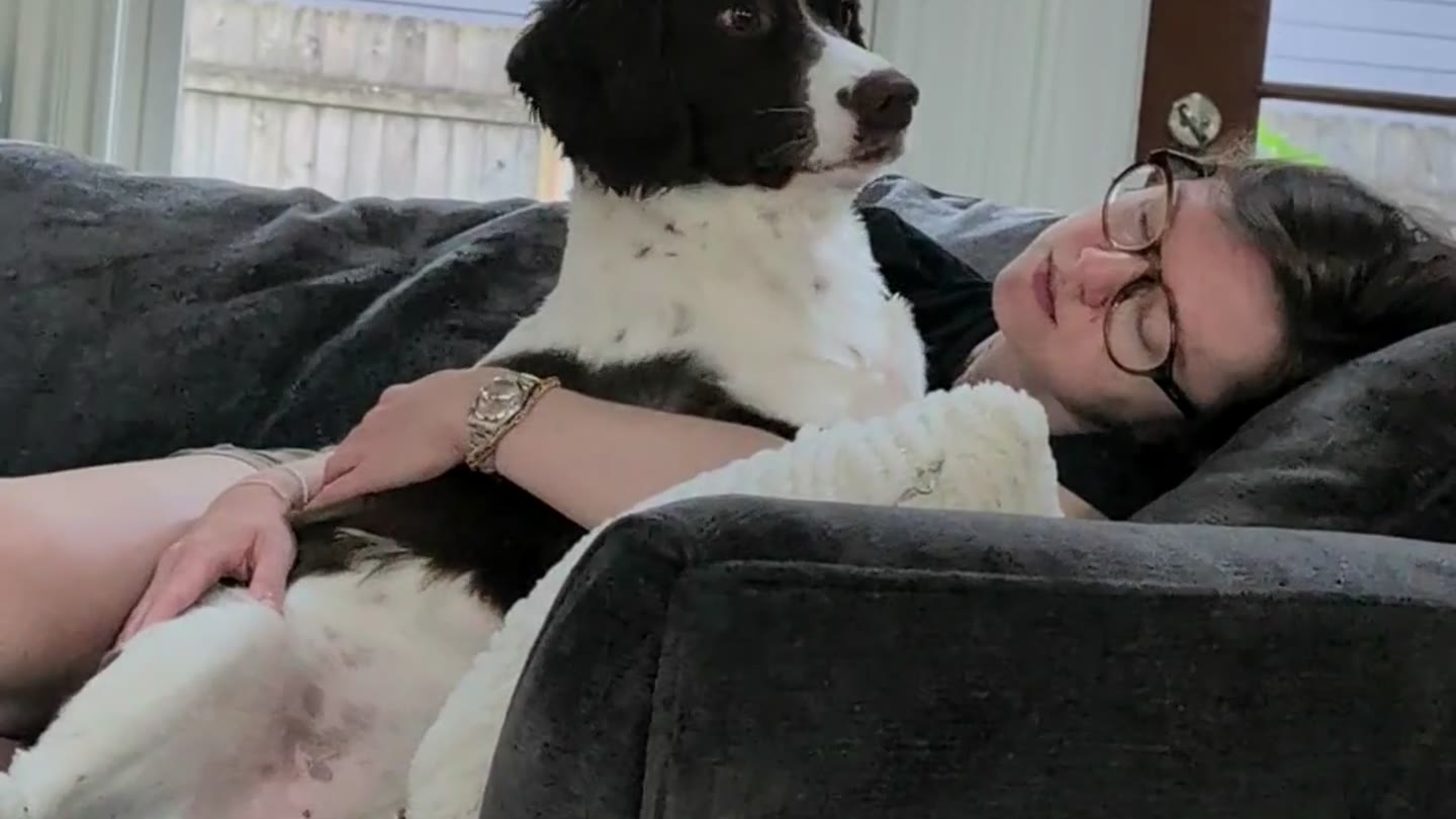 Jaymie resting on the couch with Phoebe.